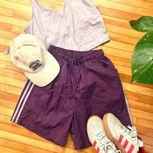 Adidas Purple Athletic Shorts with Three-Stripe Design